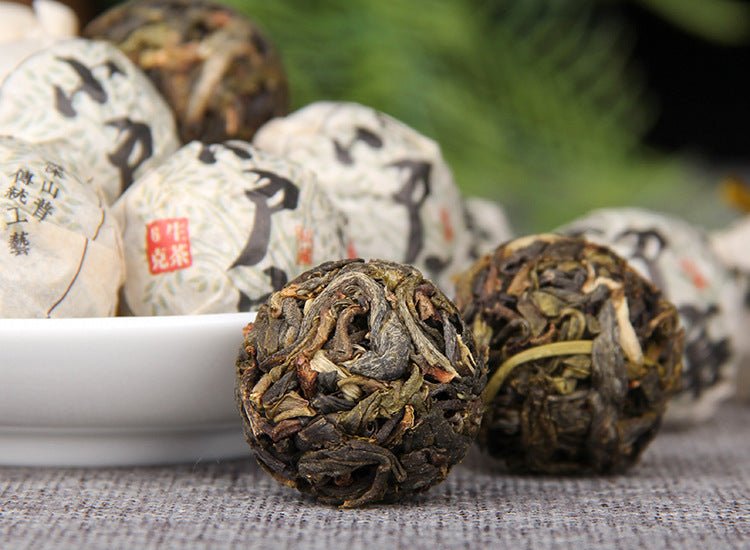 Xiaohusai Lincang raw Pu-erh dragon pearl detail