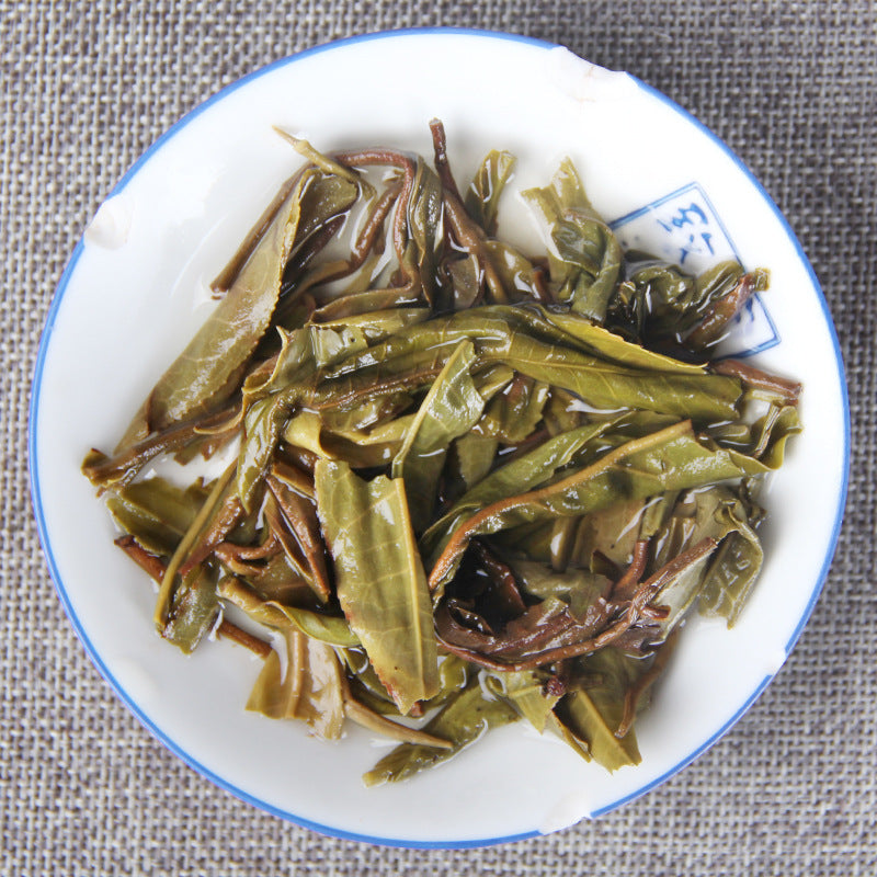 Infused leaves of Xigui ancient-tree raw Pu-erh tea cake 昔归生茶叶底