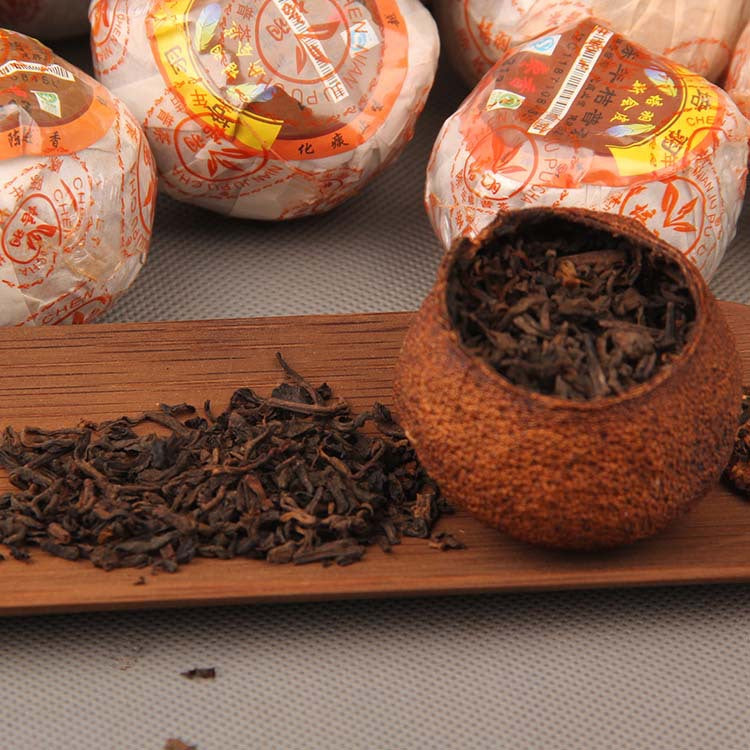 Opened Xinhui mandarin peel with ripe Pu-erh tea leaves inside