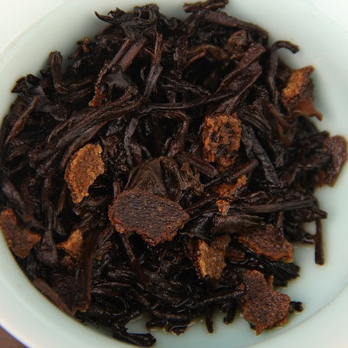 Brewed Xinhui mandarin peel and ripe Pu-erh wet tea leaves