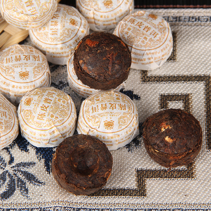 Xinhui Chenpi Ripe Pu-erh mini tuocha wrapped and unwrapped 新会陈皮熟普小沱