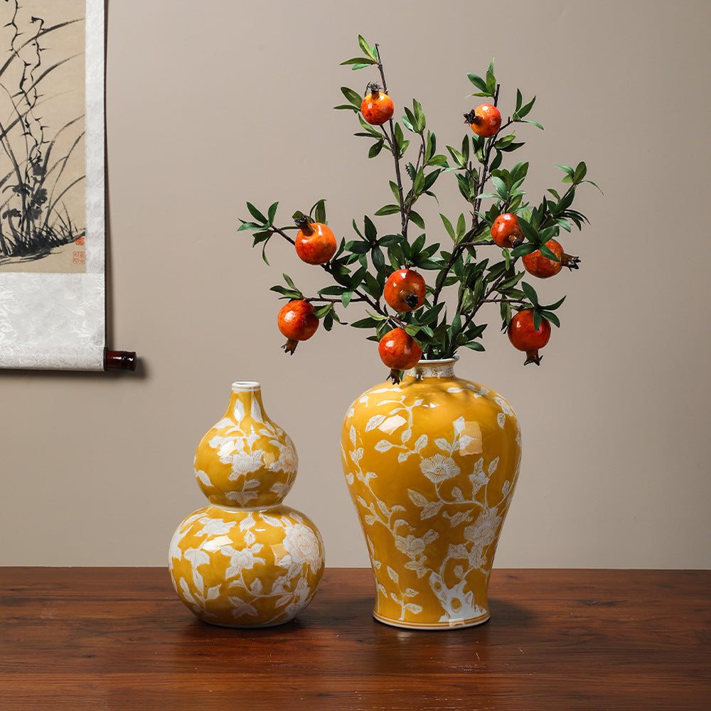 Yellow gourd, yellow Meiping and wine-red floral Chinese ceramic vases styled together