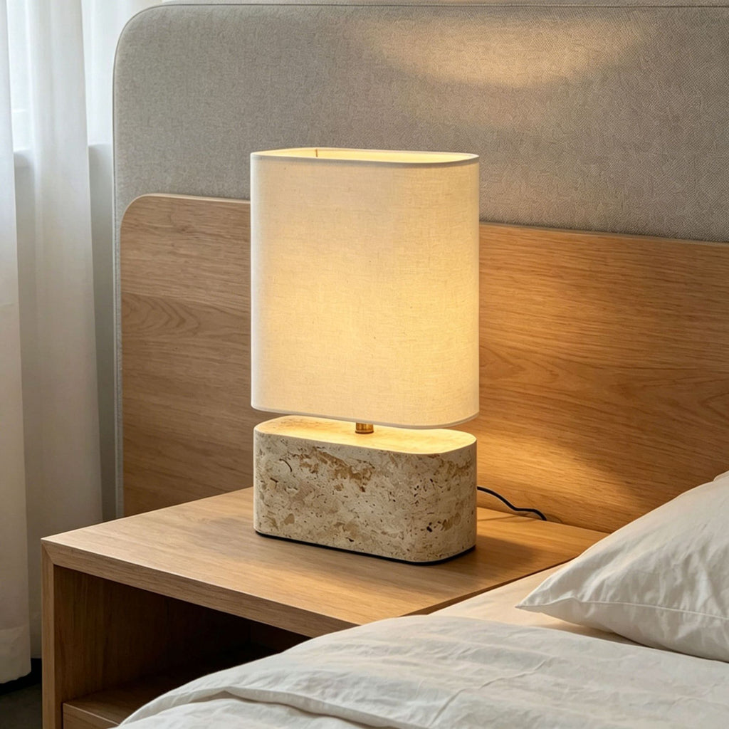Compact yellow travertine oval table lamp with ivory fabric shade