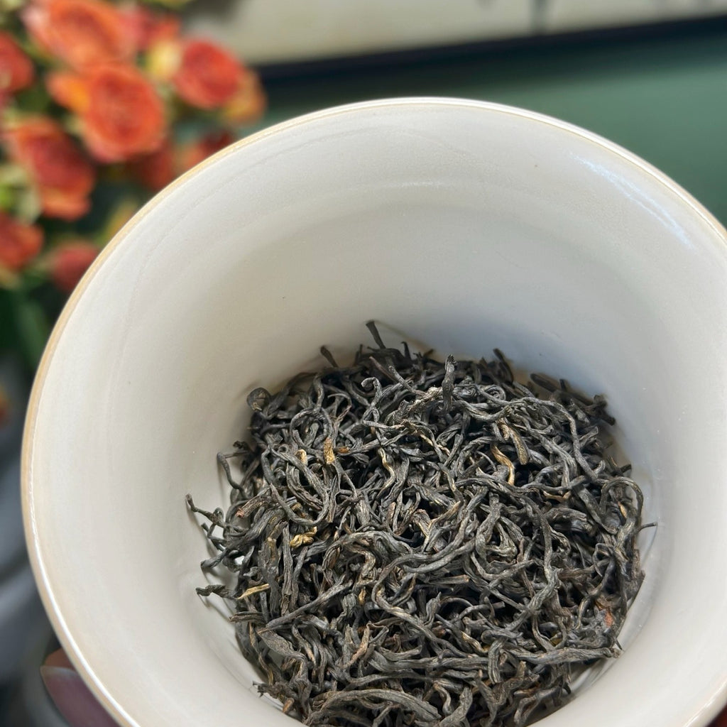 Close-up of dark twisted Zheng Shan Xiao Zhong black tea leaves